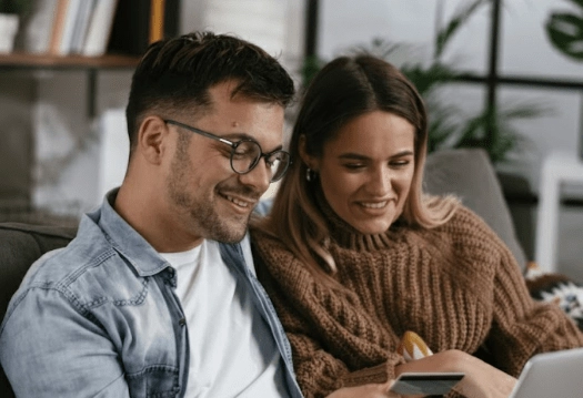 Couple cooking together in a modern kitchen.