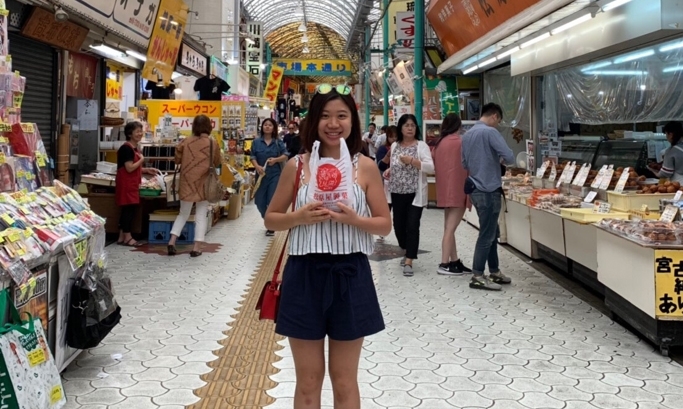 Resident Gina in a food market
