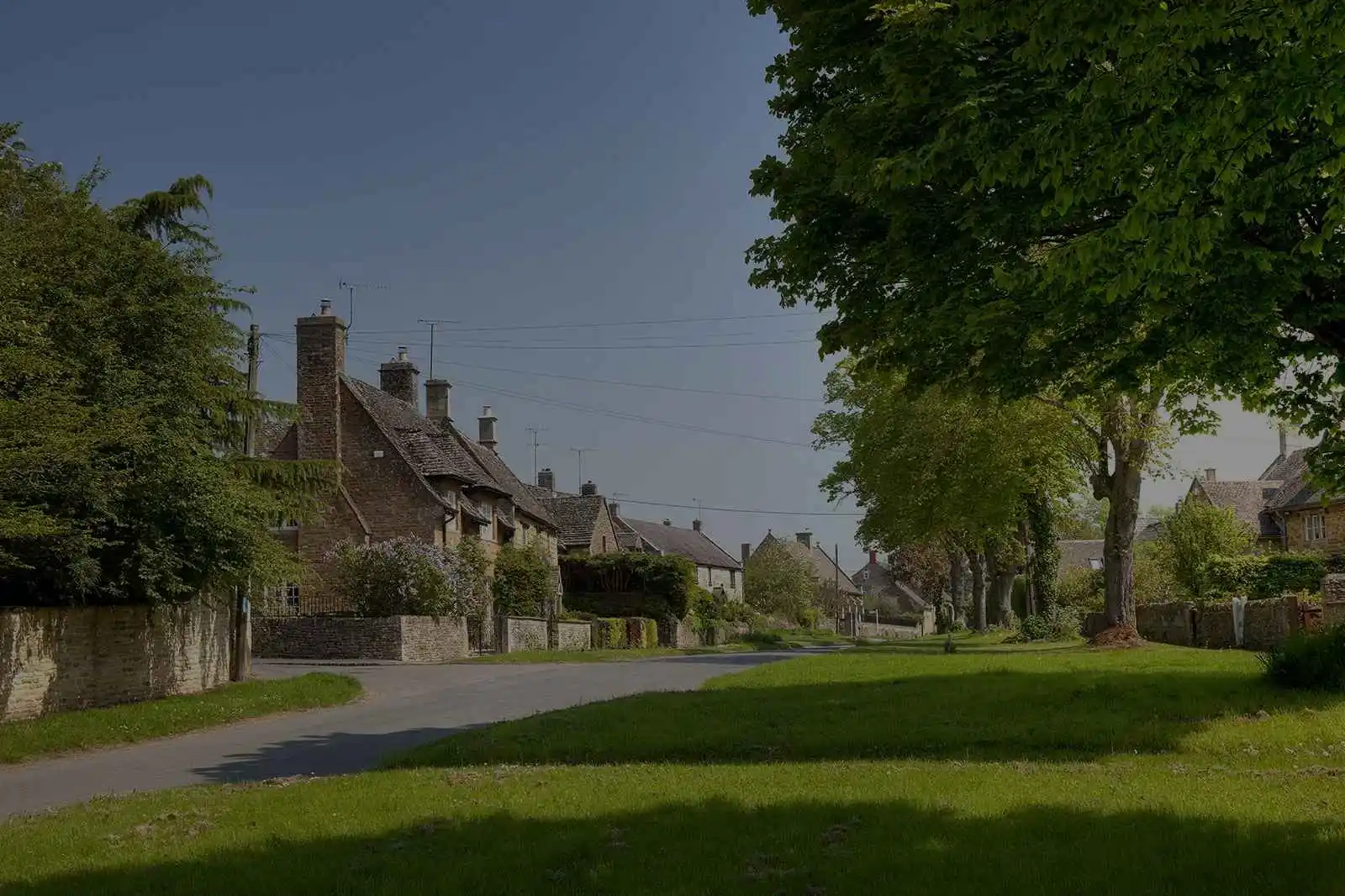 Traditional stone cottages and green open spaces in an Oxfordshire village near Begbroke Science Park